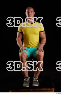 Sitting reference of whole yellow shirt turquoise shorts brown shoes…